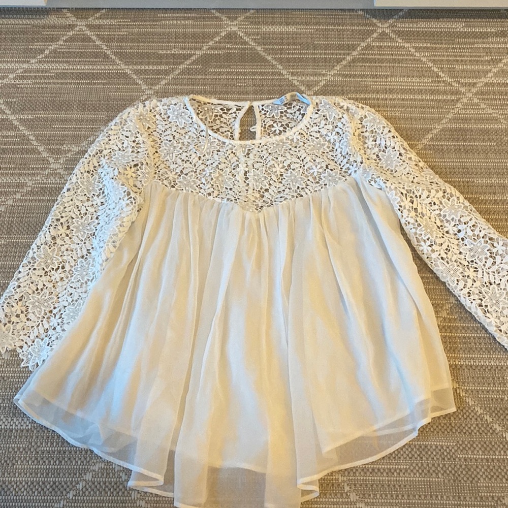 White blouse with detailed sleves